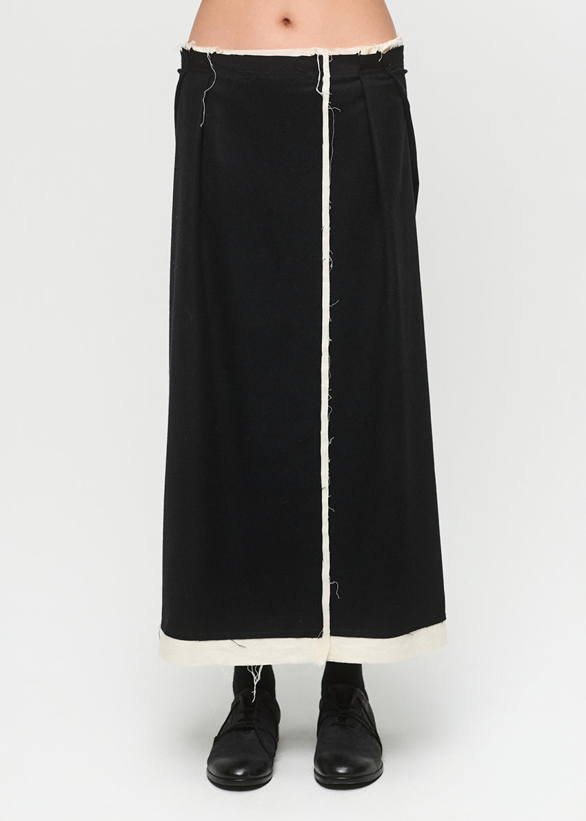 Black outfit with white stitching on a plain background