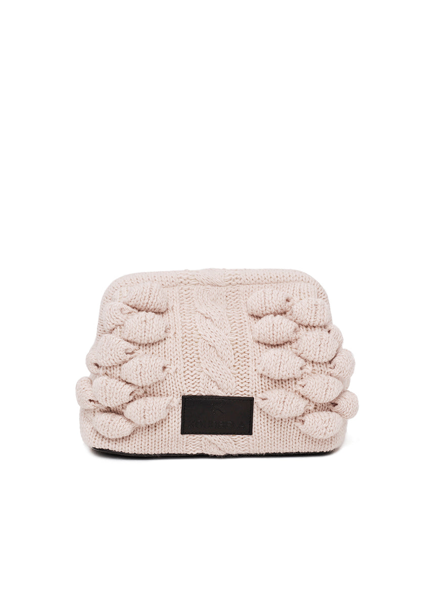 Beige knitted headband with a black label on a white background