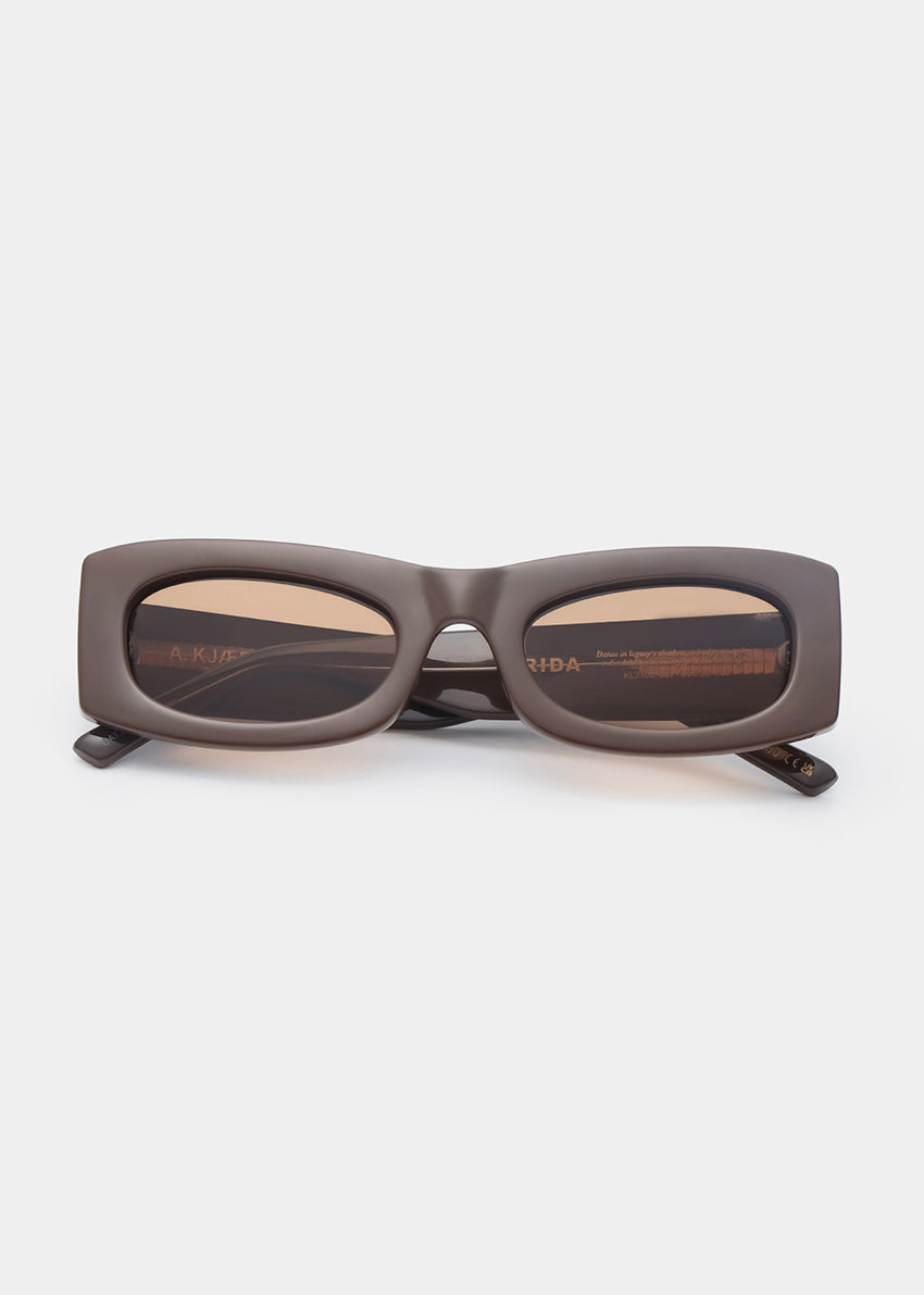 Chocolate sunglasses with a rectangular frame on a white background