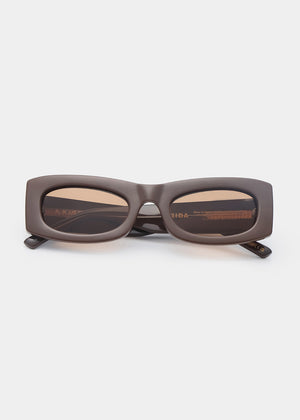 Chocolate sunglasses with a rectangular frame on a white background