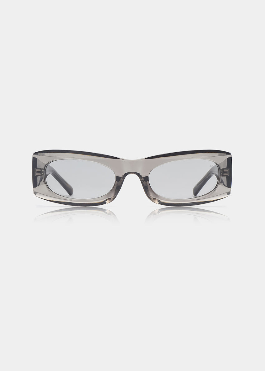 Sunglasses with a transparent grey frame on a white background