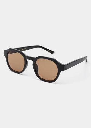 Black sunglasses with brown lenses on a white background