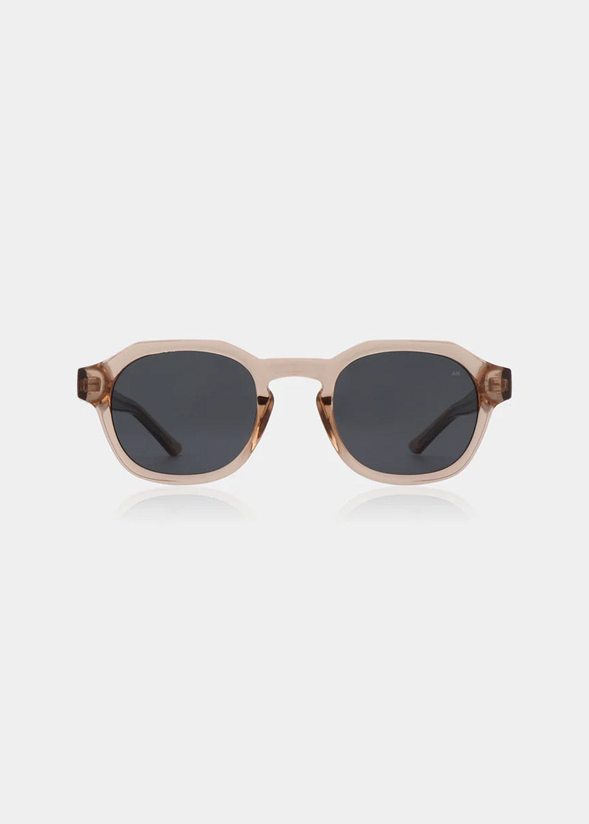 Sunglasses with a champagne frame and dark lenses on a white background