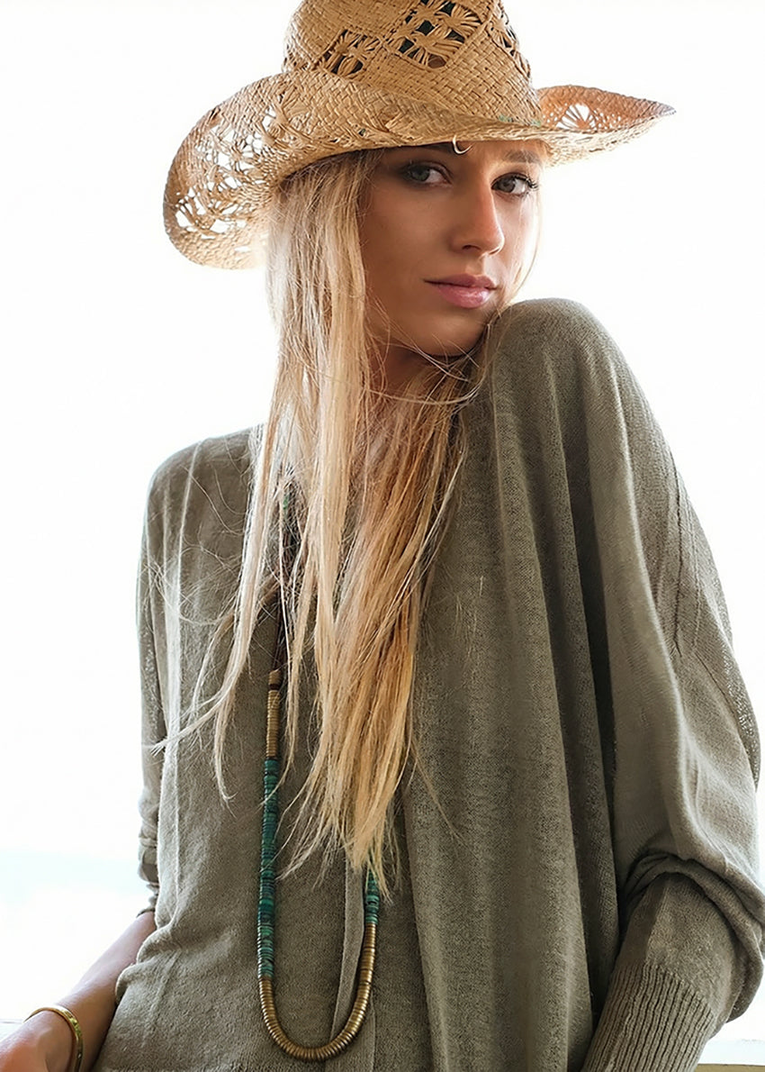 A khaki green, linen-blend, V-neck pullover sweater with dropped shoulder sleeves and side slits.