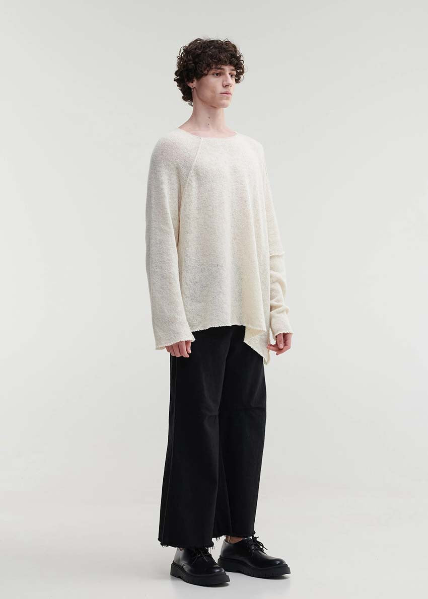 Raw edges punk sweater with dropped shoulders and an eye-catching asymmetric hemline for a stylish yet cozy and casual look.Because of the mix of fibres, like wool and silk, the texture of the sweater feel really soft and warm on the skin.