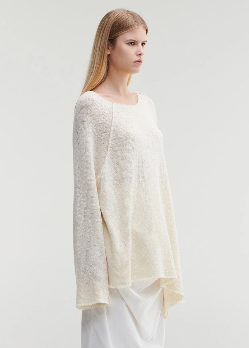Raw edges punk sweater with dropped shoulders and an eye-catching asymmetric hemline for a stylish yet cozy and casual look.Because of the mix of fibres, like wool and silk, the texture of the sweater feel really soft and warm on the skin.
