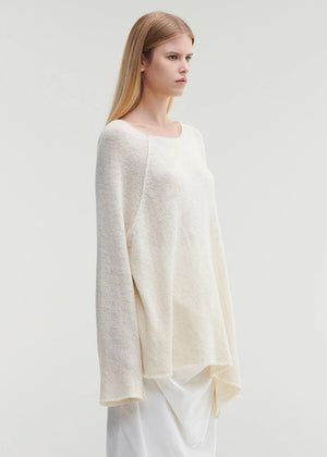 Raw edges punk sweater with dropped shoulders and an eye-catching asymmetric hemline for a stylish yet cozy and casual look.Because of the mix of fibres, like wool and silk, the texture of the sweater feel really soft and warm on the skin.