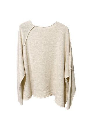 Raw edges punk sweater with dropped shoulders and an eye-catching asymmetric hemline for a stylish yet cozy and casual look.Because of the mix of fibres, like wool and silk, the texture of the sweater feel really soft and warm on the skin.