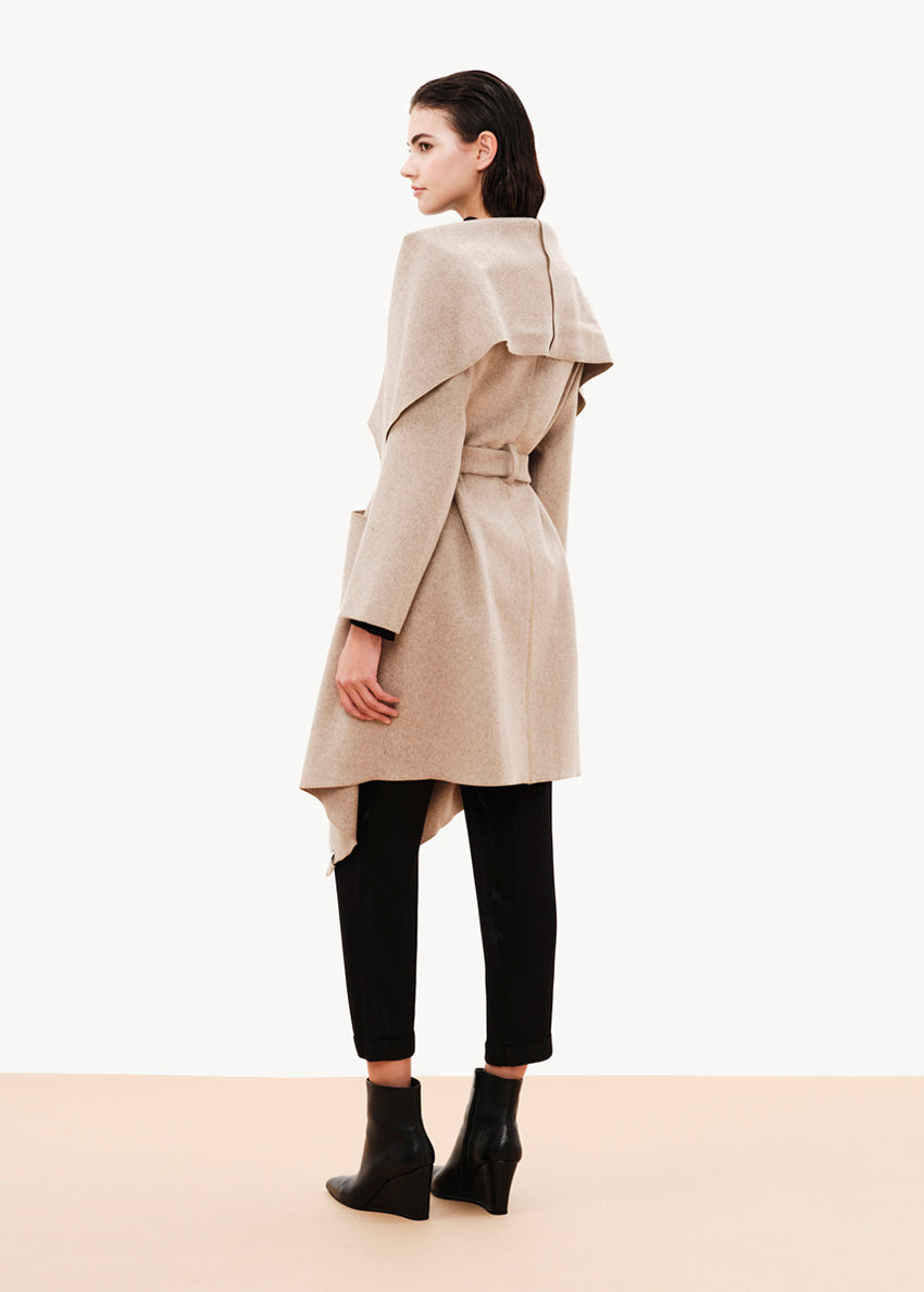 Elegant, unique, and effortless draped jacket made of wool blend, is the perfect alternative for your winter outfits. Its stylish character combined with its relaxed design result in a garment that could upgrade even the simplest of outfits.