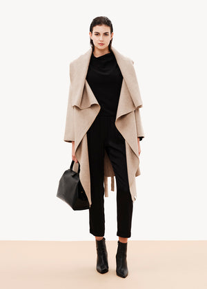 Elegant, unique, and effortless draped jacket made of wool blend, is the perfect alternative for your winter outfits. Its stylish character combined with its relaxed design result in a garment that could upgrade even the simplest of outfits.