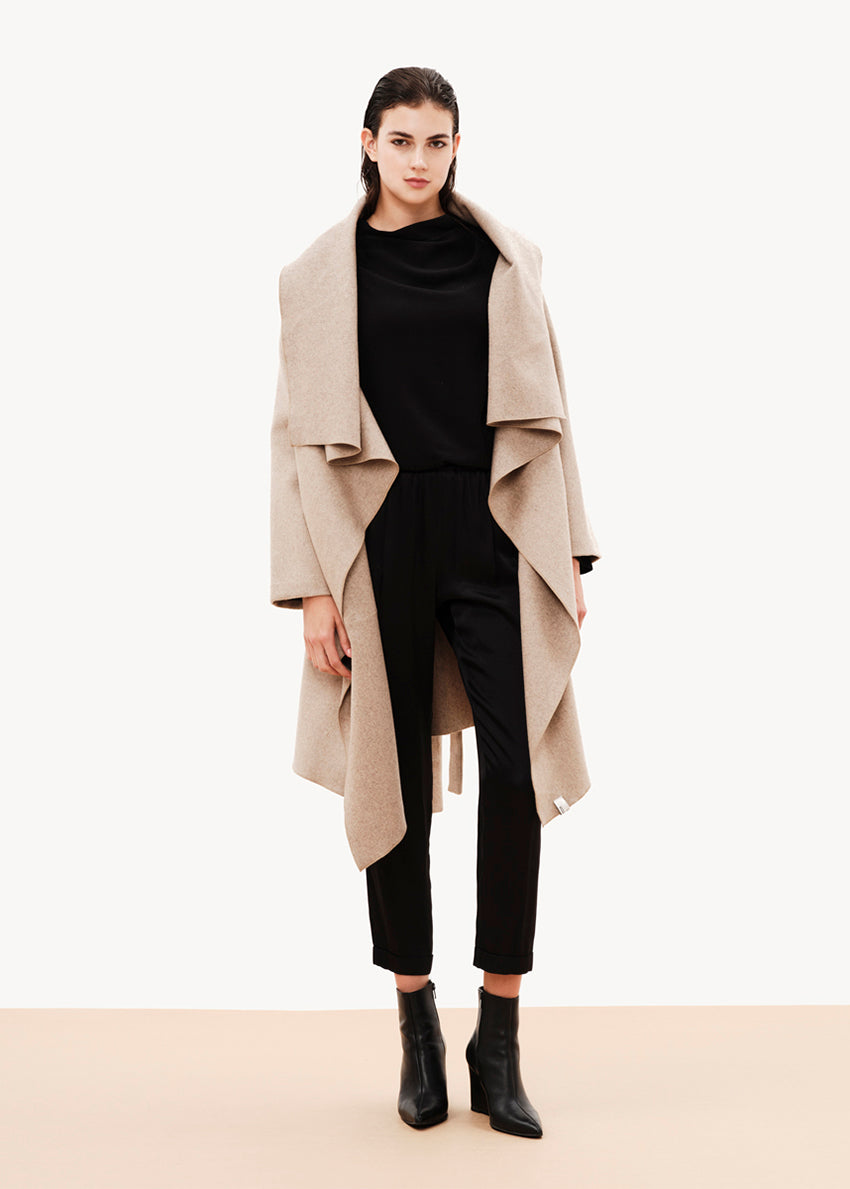 Elegant, unique, and effortless draped jacket made of wool blend, is the perfect alternative for your winter outfits. Its stylish character combined with its relaxed design result in a garment that could upgrade even the simplest of outfits.