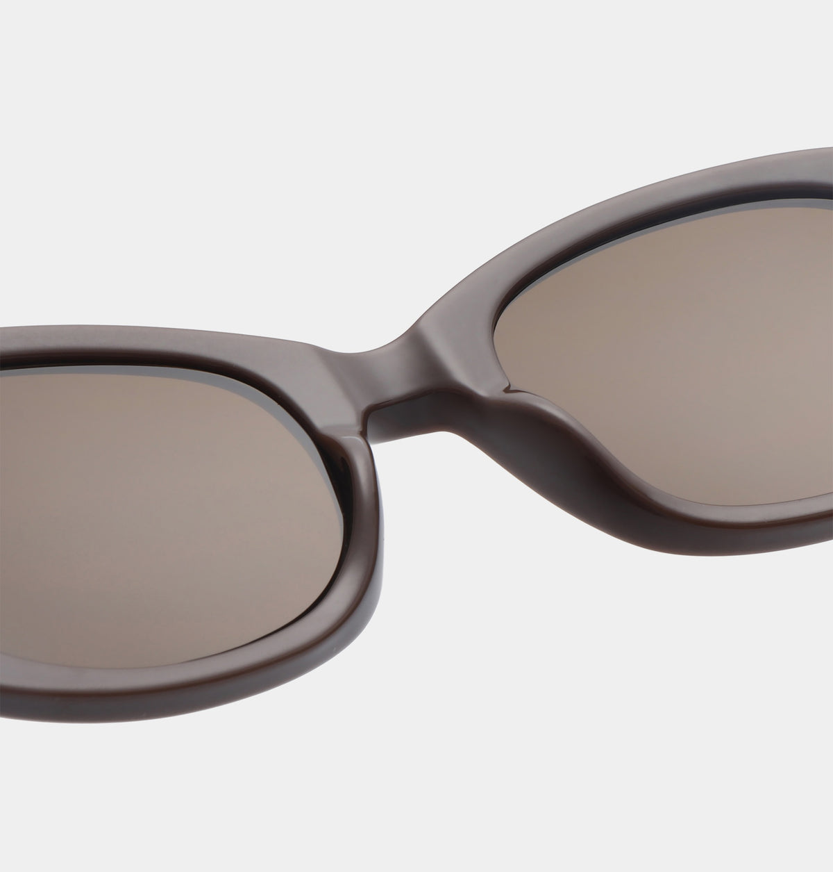 Sunglasses with a brown frame and reflective lenses on a white background