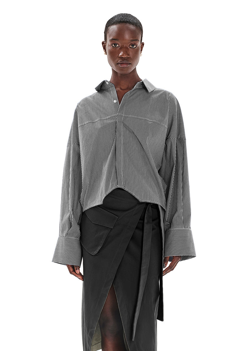 Made with durable, high-quality cotton fabric, this skirt is designed with a unique wrap-style and boasts a large pocket and generous front slit. Perfect for everyday wear!