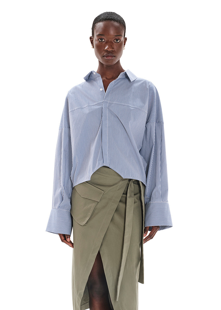 Made with durable, high-quality cotton fabric, this skirt is designed with a unique wrap-style and boasts a large pocket and generous front slit. Perfect for everyday wear!