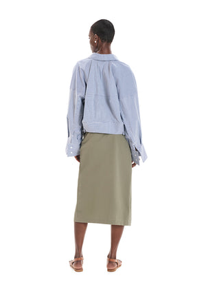 Made with durable, high-quality cotton fabric, this skirt is designed with a unique wrap-style and boasts a large pocket and generous front slit. Perfect for everyday wear!