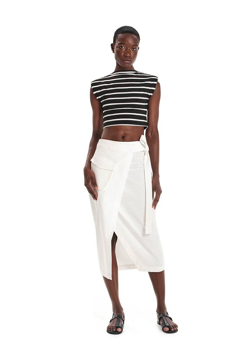 Made with durable, high-quality cotton fabric, this skirt is designed with a unique wrap-style and boasts a large pocket and generous front slit. Perfect for everyday wear!