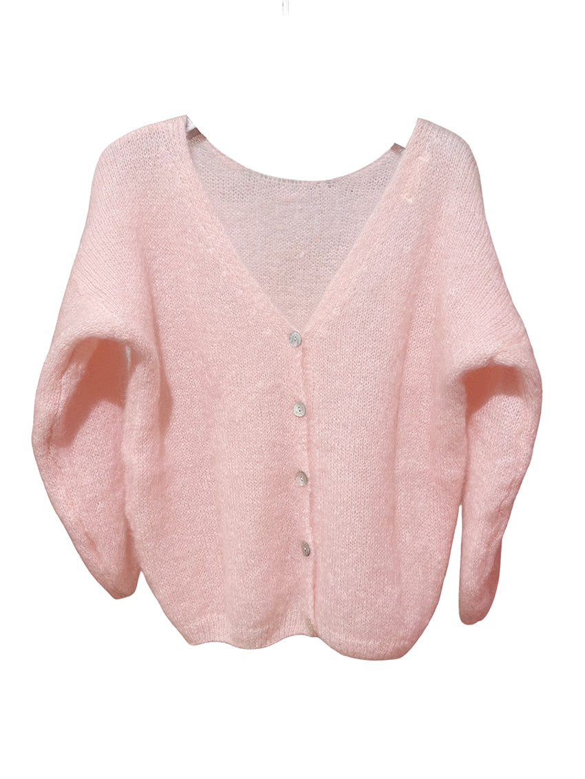 Pink cardigan on a white background