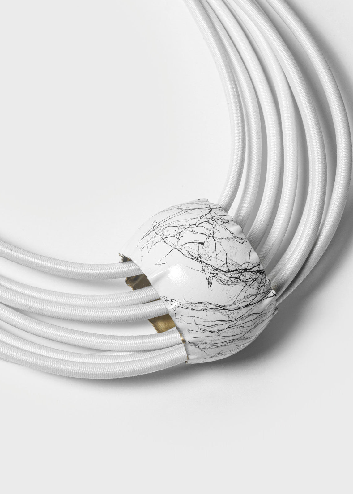 A white, multi-layered choker necklace with a cylindrical pendant and dimgray details, designed by Katerina Vassou.