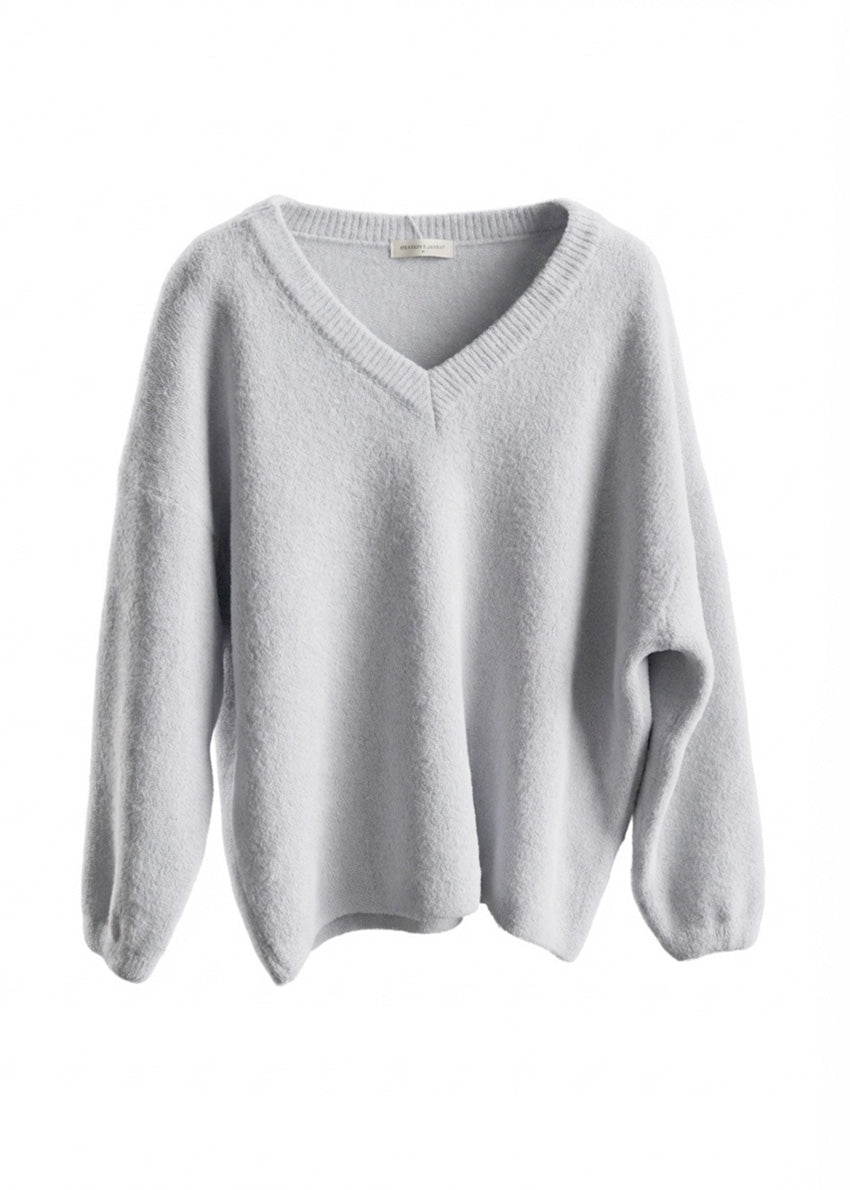 Light gray sweater on a white background
