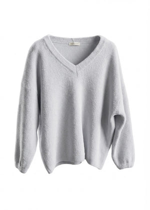 Light gray sweater on a white background