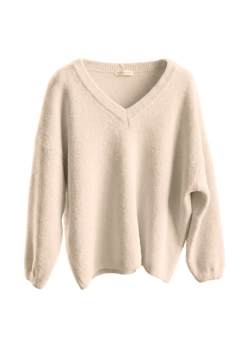 Beige sweater on a white background