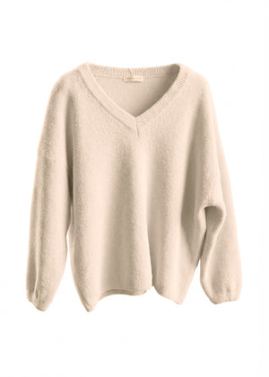 Beige sweater on a white background