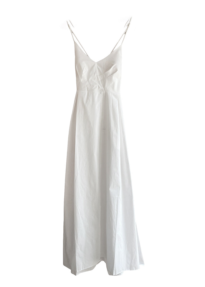 Midi asymmetrical dress made of 100% silky touch cotton poplin that features a “V” neck and open back. With a cinched waist and a figure-hugging pattern at the bust it has details with ropes that tie at the back creating an “X” shape. It has a concealed zipper and side pockets while it also has a button inside the skirt to create an asymmetry at the hemline.