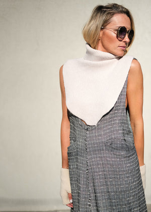 A white, ribbed, knitted neck collar