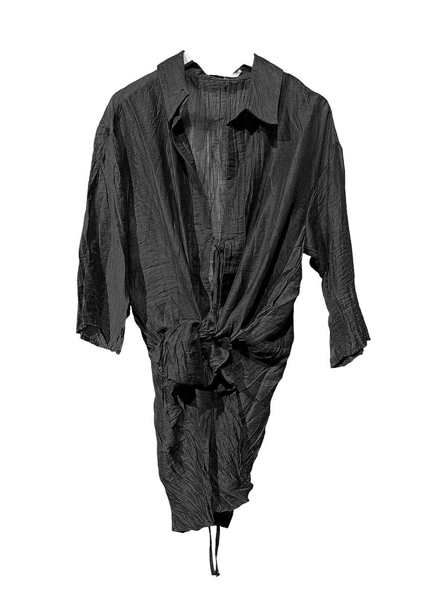 Black textured garment on a white background