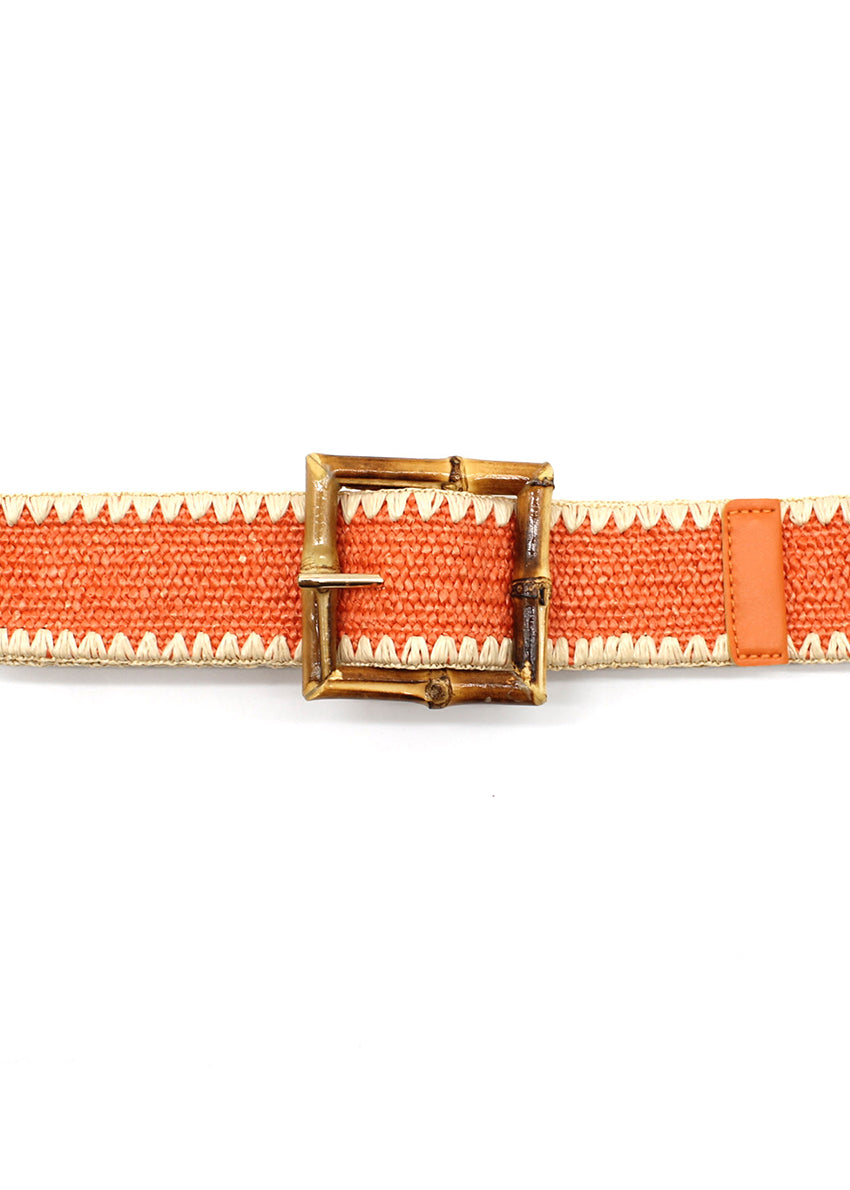 A pink woven belt with a bamboo-inspired buckle and zigzag stitching detail.