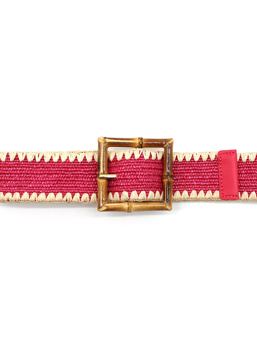 A pink woven belt with a bamboo-inspired buckle and zigzag stitching detail.