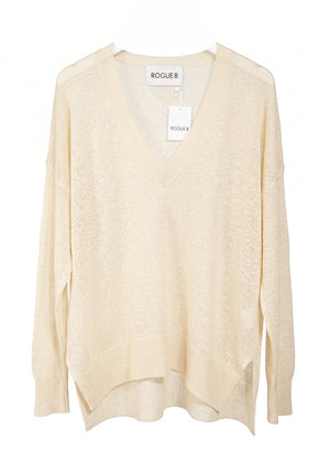 Beige sweater with a visible brand label on a white background