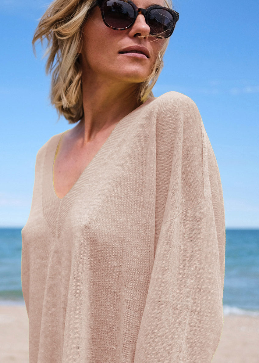 A true effortless essential, this graceful pullover is the perfect finish to any look casual style with deep V neck and dropped over the wrist sleeves, slits on the sides, longer on the back