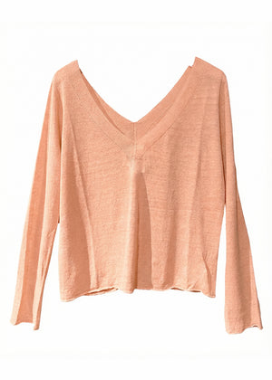 Pink long-sleeve top on a white background