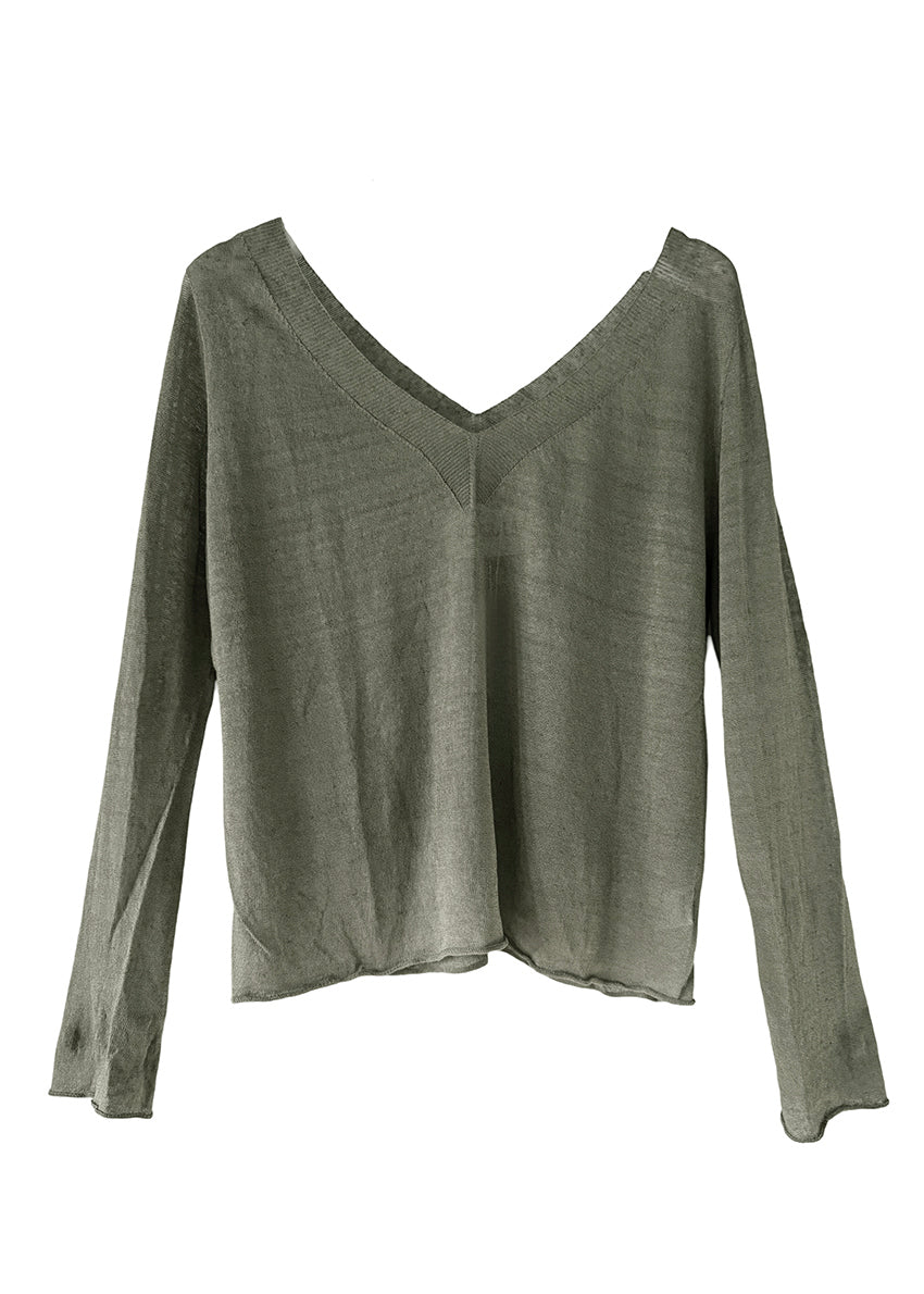 The sweater showcases a deep V-neckline at the front and back, adding a touch of sophistication to its minimalistic design.