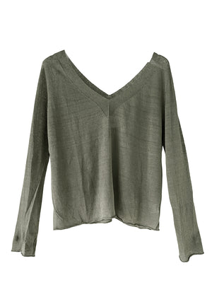 The sweater showcases a deep V-neckline at the front and back, adding a touch of sophistication to its minimalistic design.