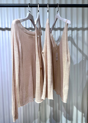 This top is like the sexy alter ego of the Miaou Top, complete with a playful halter back. With a wide V front neckline and open halter back, it's perfect for pairing with a matching bra or bustiere. Its lightweight and slightly sheer texture