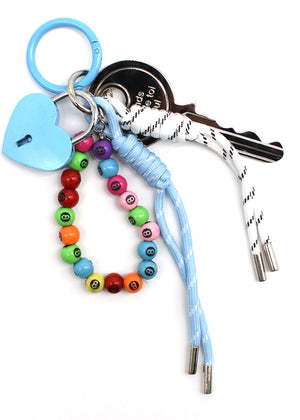 Keychain with colorful beads, heart-shaped charm, and keys on a white background