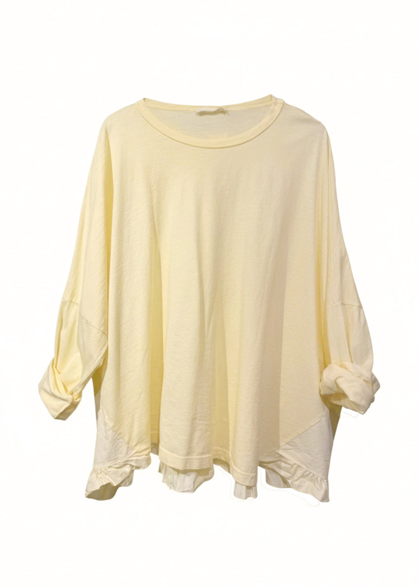 Light yellow oversized shirt on a white background