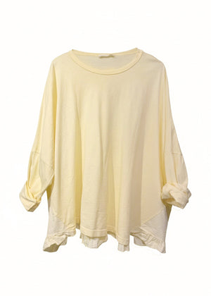 Light yellow oversized shirt on a white background