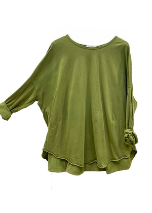 Green long-sleeve top on a white background