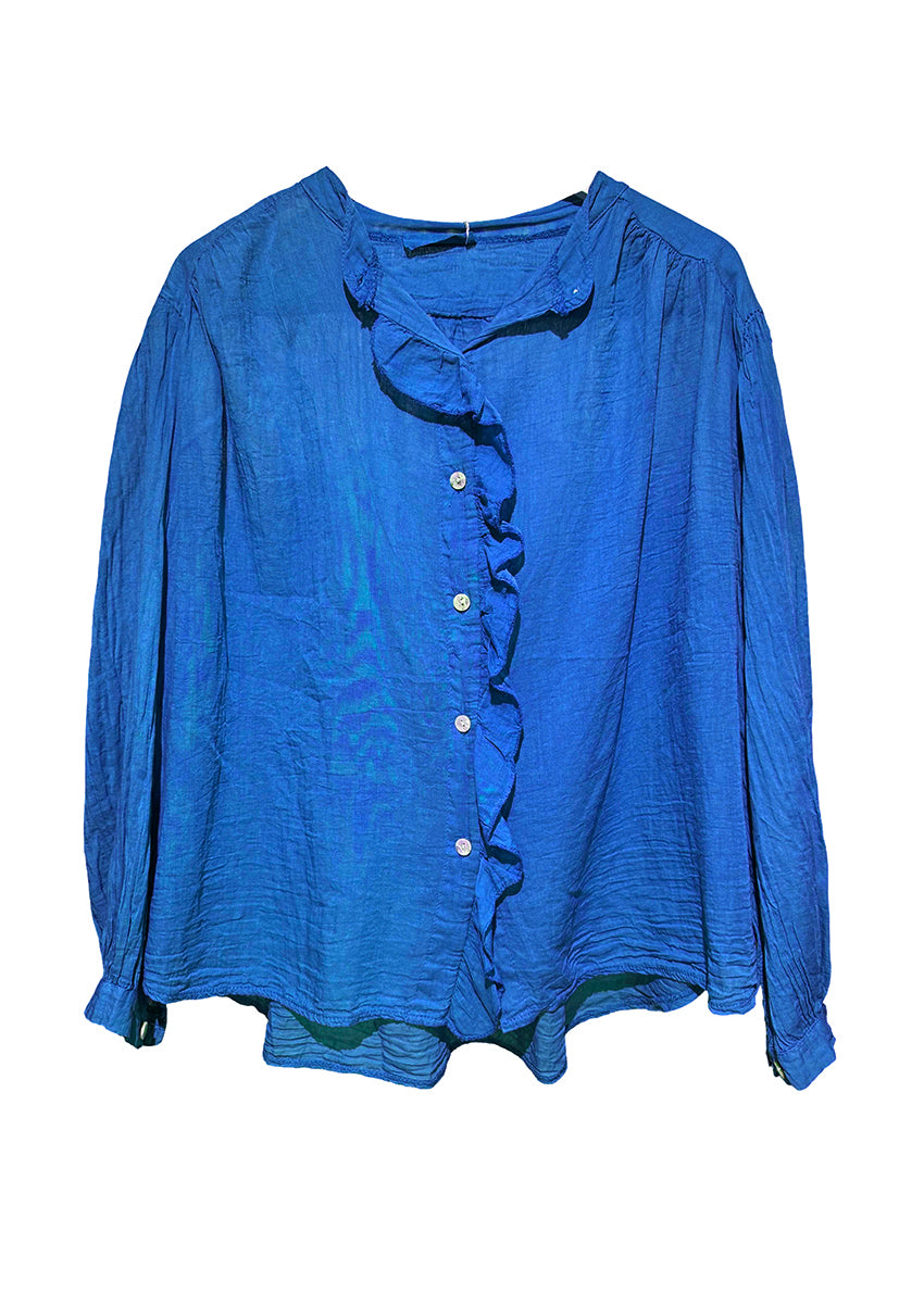 Blue blouse with ruffled details on a white background