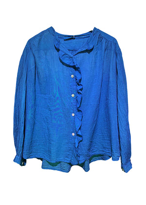 Blue blouse with ruffled details on a white background