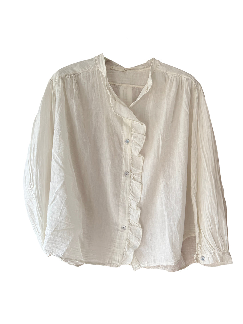 White blouse with ruffled details on a white background