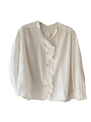 White blouse with ruffled details on a white background