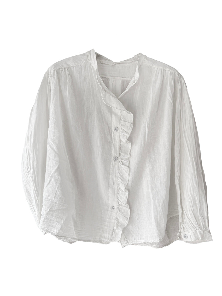 White blouse with ruffled details on a white background