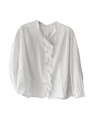 White blouse with ruffled details on a white background