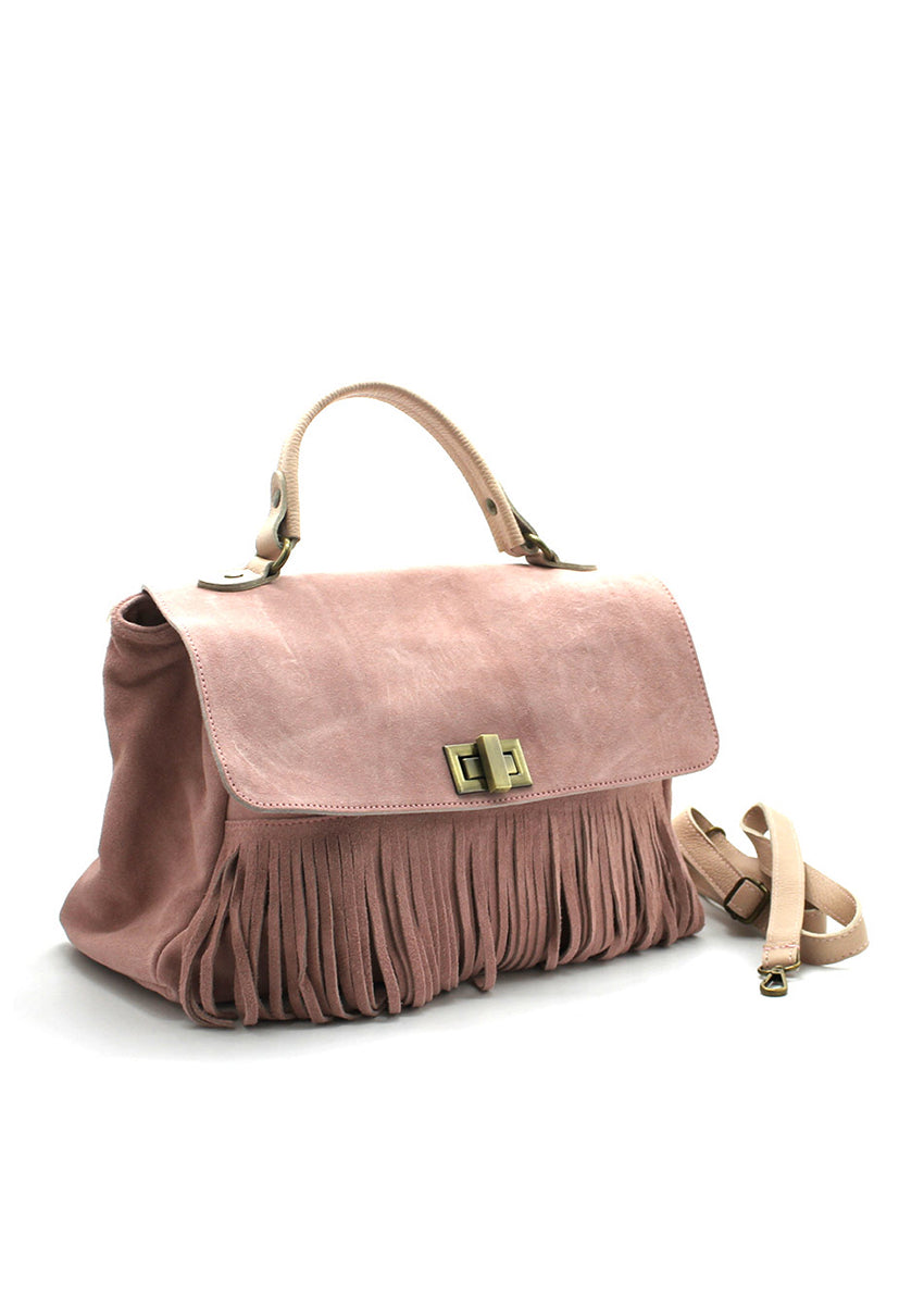 A pink suede handbag with a cascade of leather fringes in the central part, positioned against a white background.