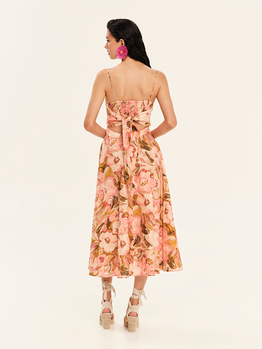Woman wearing a floral dress on a white background