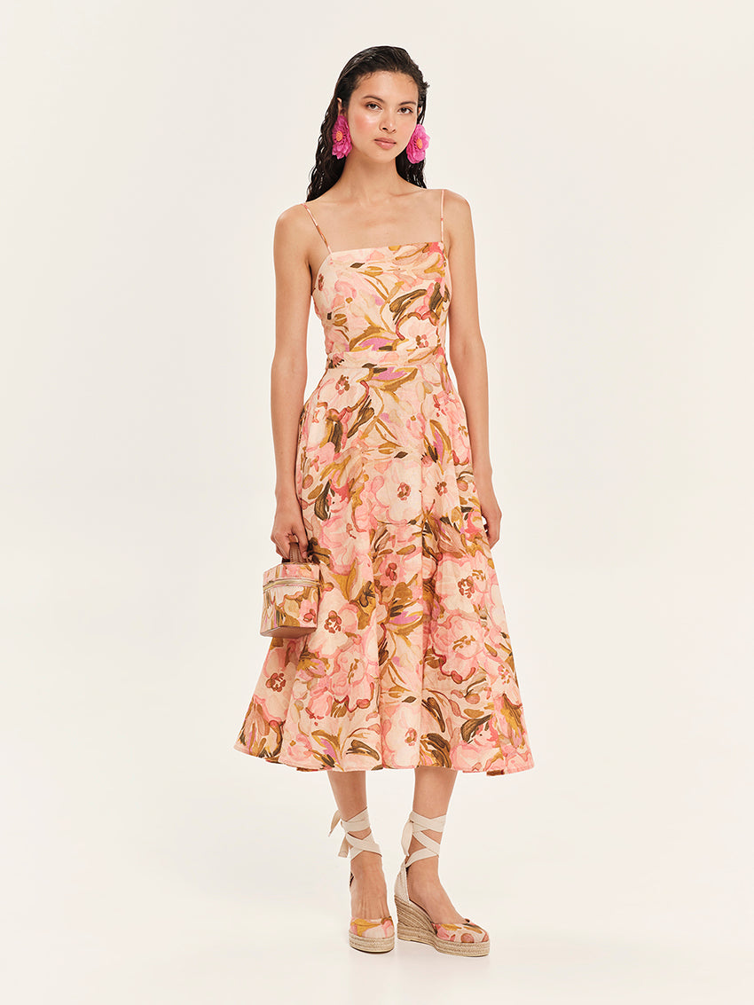 Woman wearing a floral strapless dress on a white background